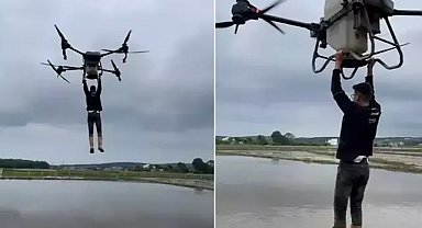 Çeltik tarlasında tehlikeli yolculuk: Drona asılıp uçtu