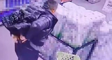 Marketten alkol çaldı, kimse görmeden şişeleri pantolonun içine soktu